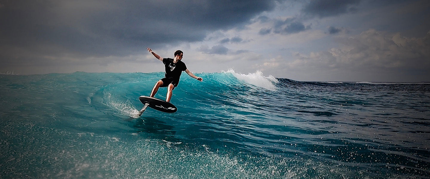 man riding hydrofoil board on foil