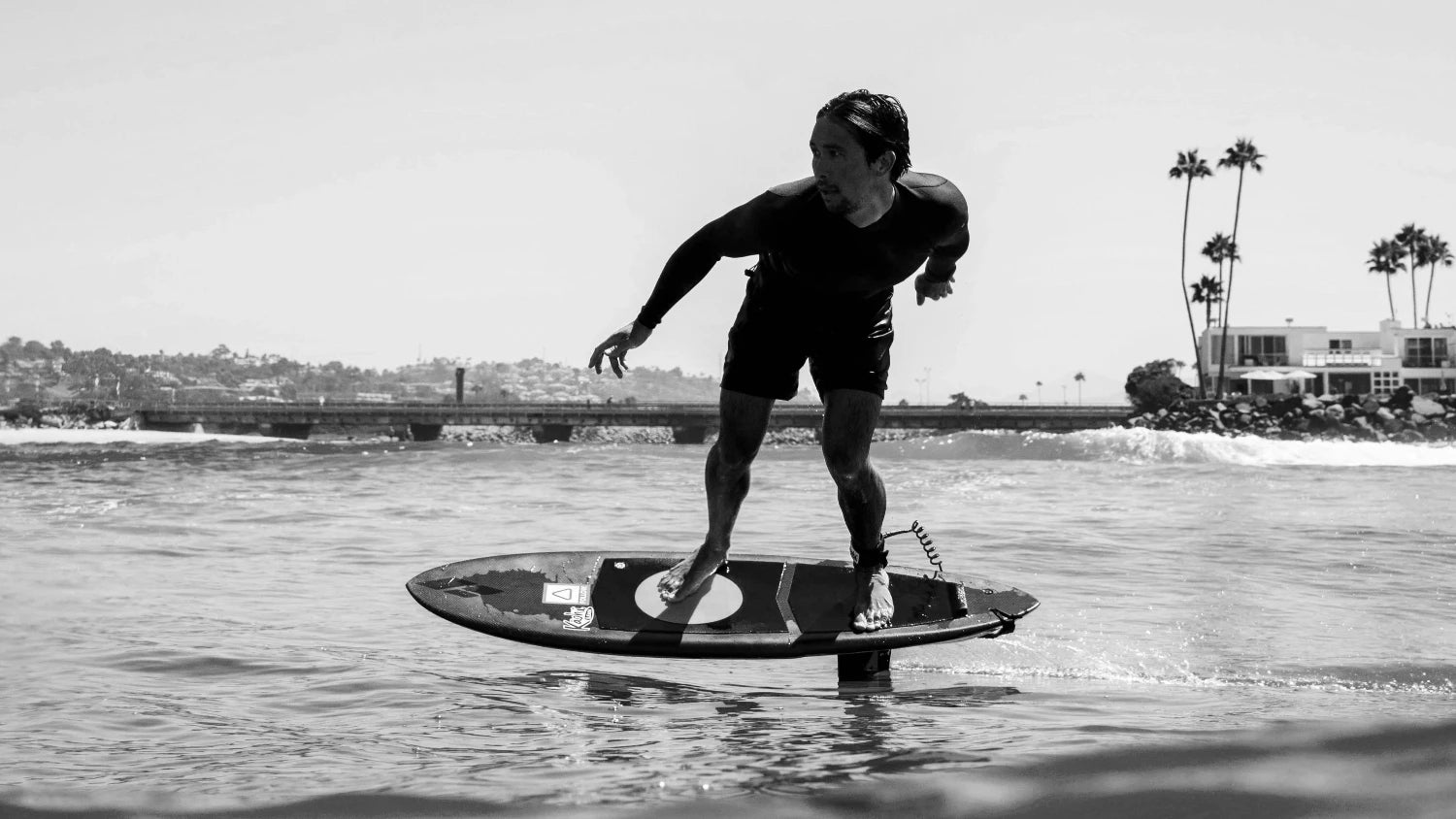 Josh Ku riding an Amos Shapes foil board