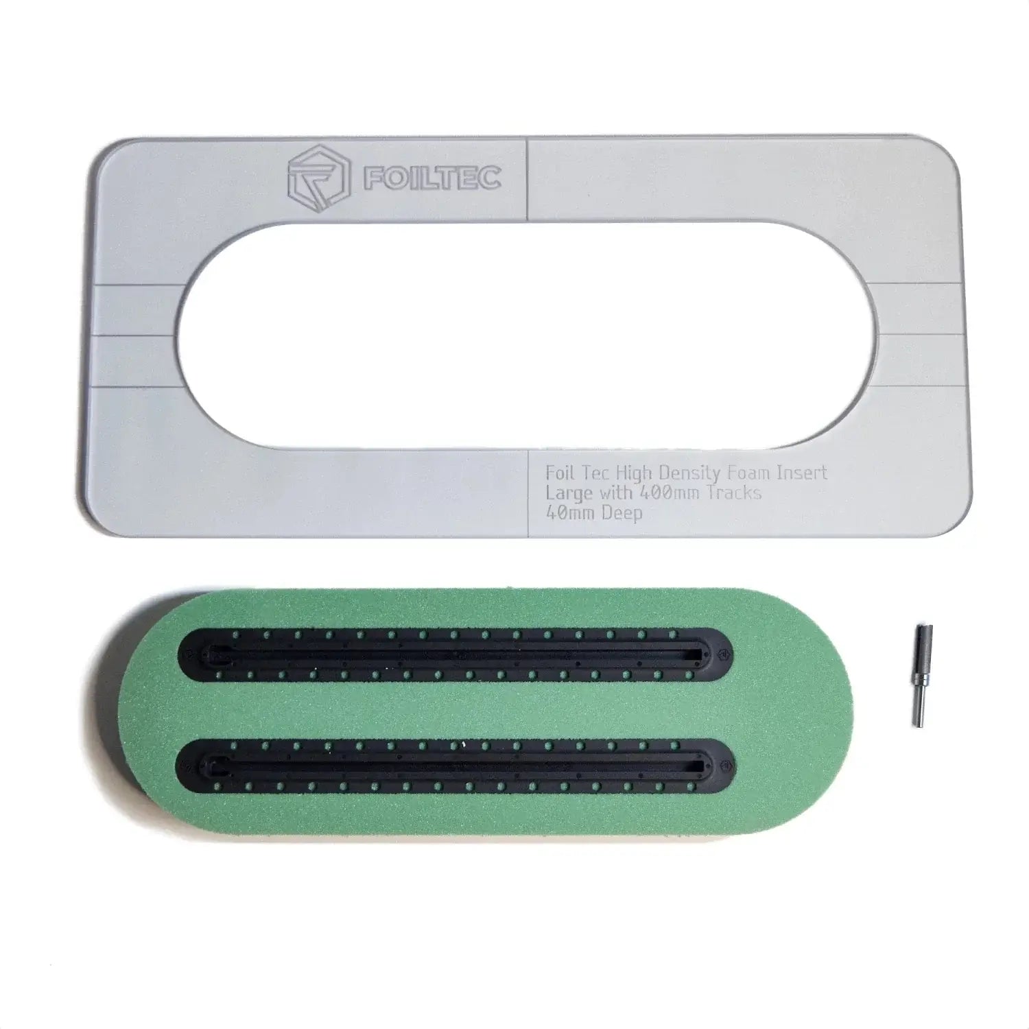 An image showing the components of the 400mm Foilboard High Density Foam Installation Jig Kit, including a gray install jig, a router bit, two green boxes representing foil tracks, and a small black object.