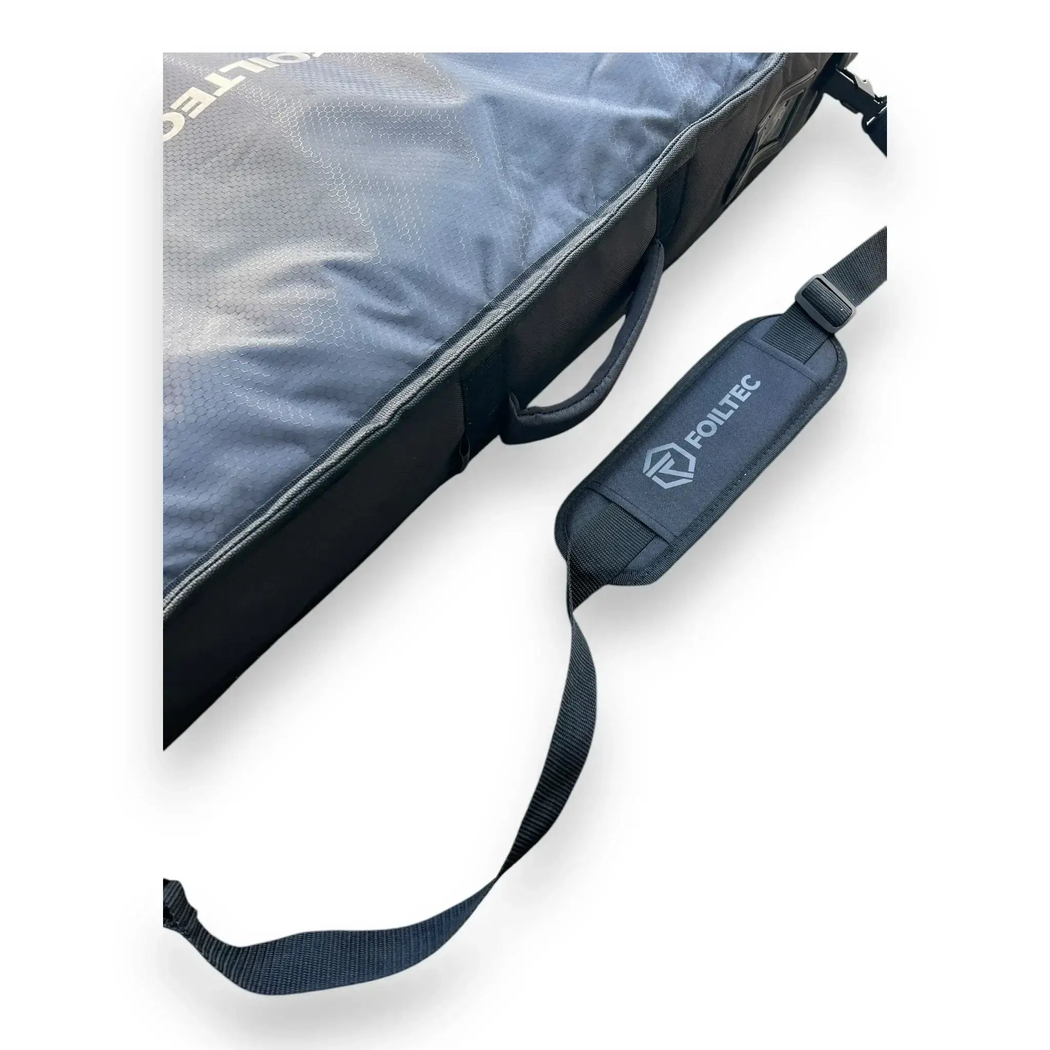 Close-up of padded shoulder strap and adjustable straps on downwind SUP bag