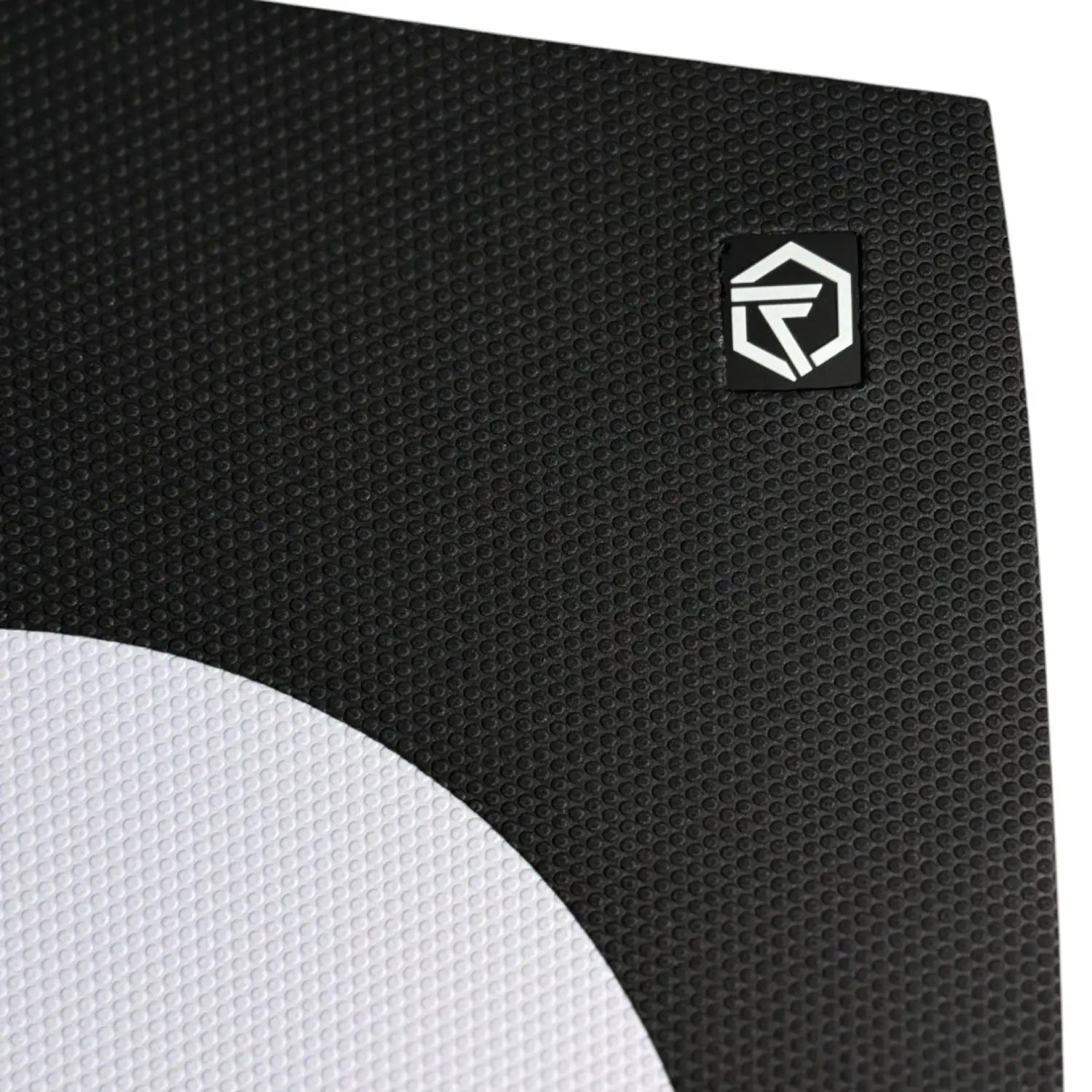 Close up of Foil Tec two piece traction pad in black and white dot with Foil Tec logo